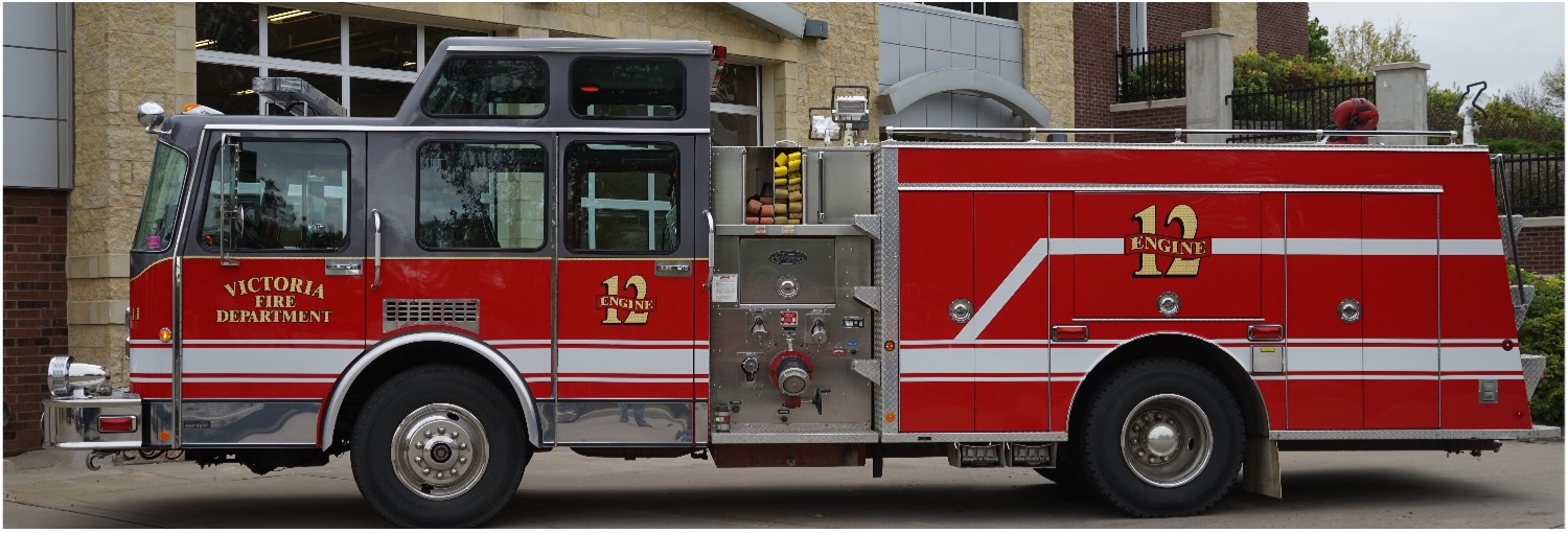 Exterior Side-view of 1991 Toyne Enclosed Top Mount Custom Fire Engine